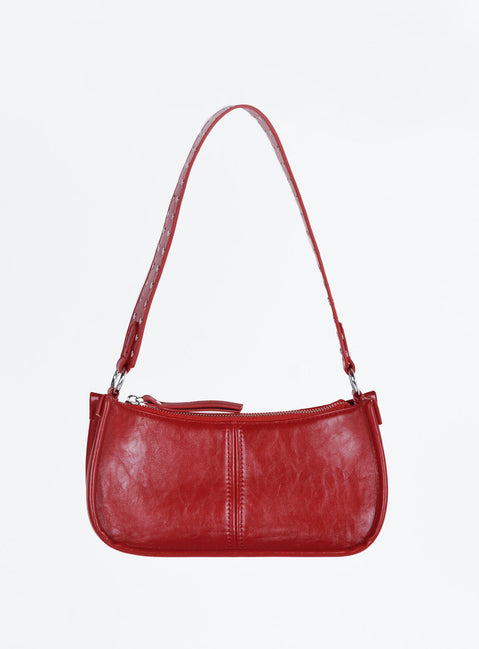 Bag Faux leather material  Vintage style  Zip fastening  Studded removable shoulder strap  Adjustable and removable crossbody strap  Inner zip pocket  Flat base 