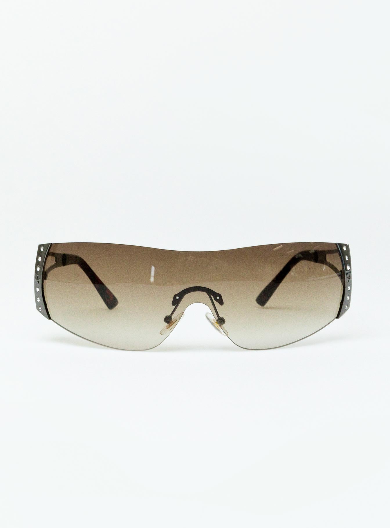 Sunglasses Frameless design Silver toned Silicone nose pads Diamante detail Clear lenses Lightweight