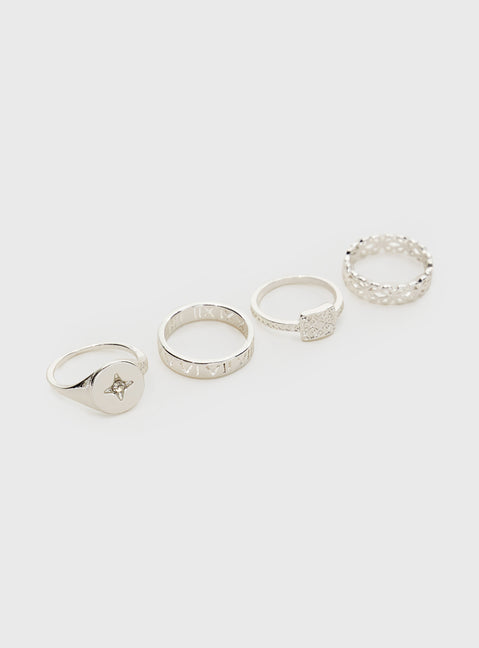 Silver toned ring set Four rings in set, all individually different, a diamonte detail on one ring Princess Polly Lower Impact
