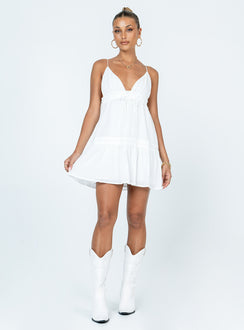 side view of model wearing Princess Polly Dionne Mini Dress White Petite Plunger 