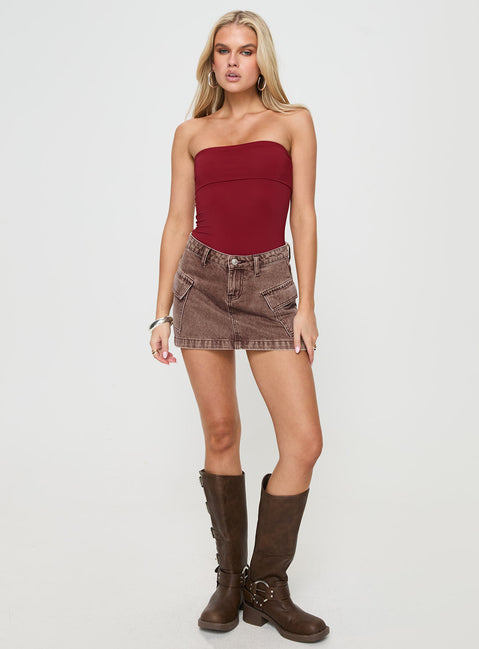 front view of model wearing Princess Polly Niner Strapless Bodysuit Burgundy Petite Sleeveless Bodysuit 