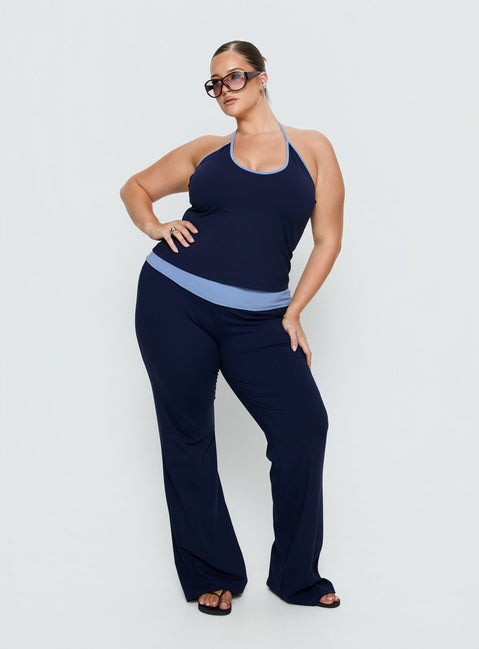 front view of model wearing Princess Polly Kobee Jersey Flare Pants Navy / Light Blue Curve High Rise Pants 