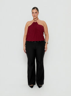 Showcasing the Yevina Eyelet Flare Pant Black Curve womens-regular-pants with mid-rise front view of model wearing Princess Polly
