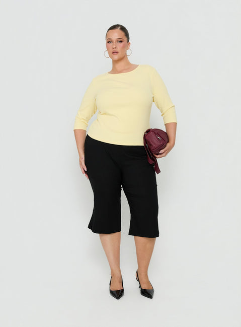 Showcase the Samaira Capri Pant Black Curve womens-regular-pants featuring high-rise detail view of model wearing Princess Polly