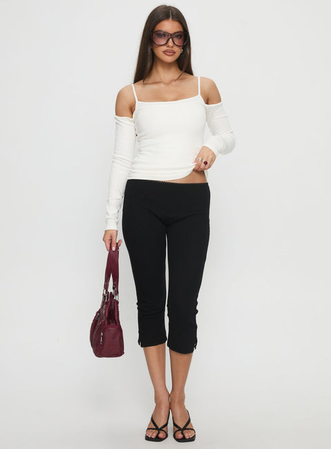 front view of model wearing Princess Polly Baseline Rib Capri Pants Black Petite Mid Rise Pants 