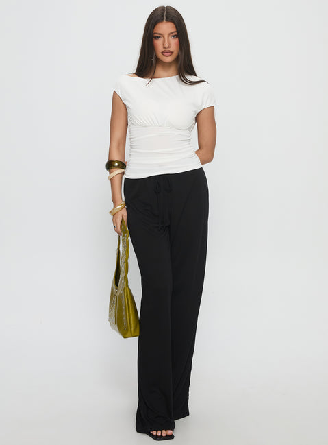 front view of model wearing Princess Polly Gavrielle Jersey Wide Leg Pants Black High Rise Pants 