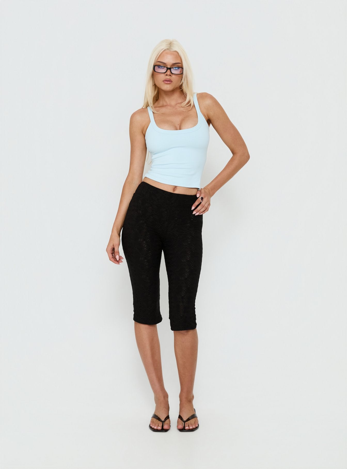 front view of model wearing Princess Polly Samaira Capri Pant Black Anglaise Mid Rise Pants 
