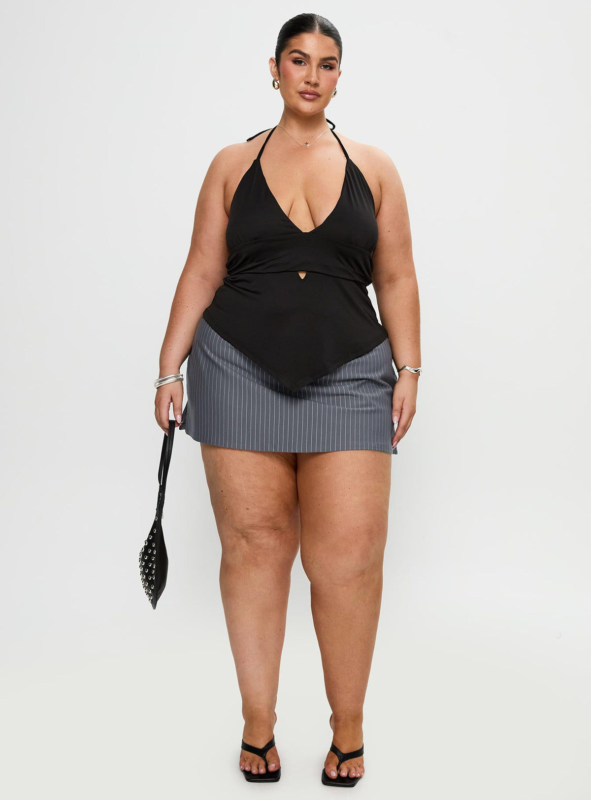 front view of model wearing Princess Polly Averee Halter Top Black Curve Sleeveless Plunger 
