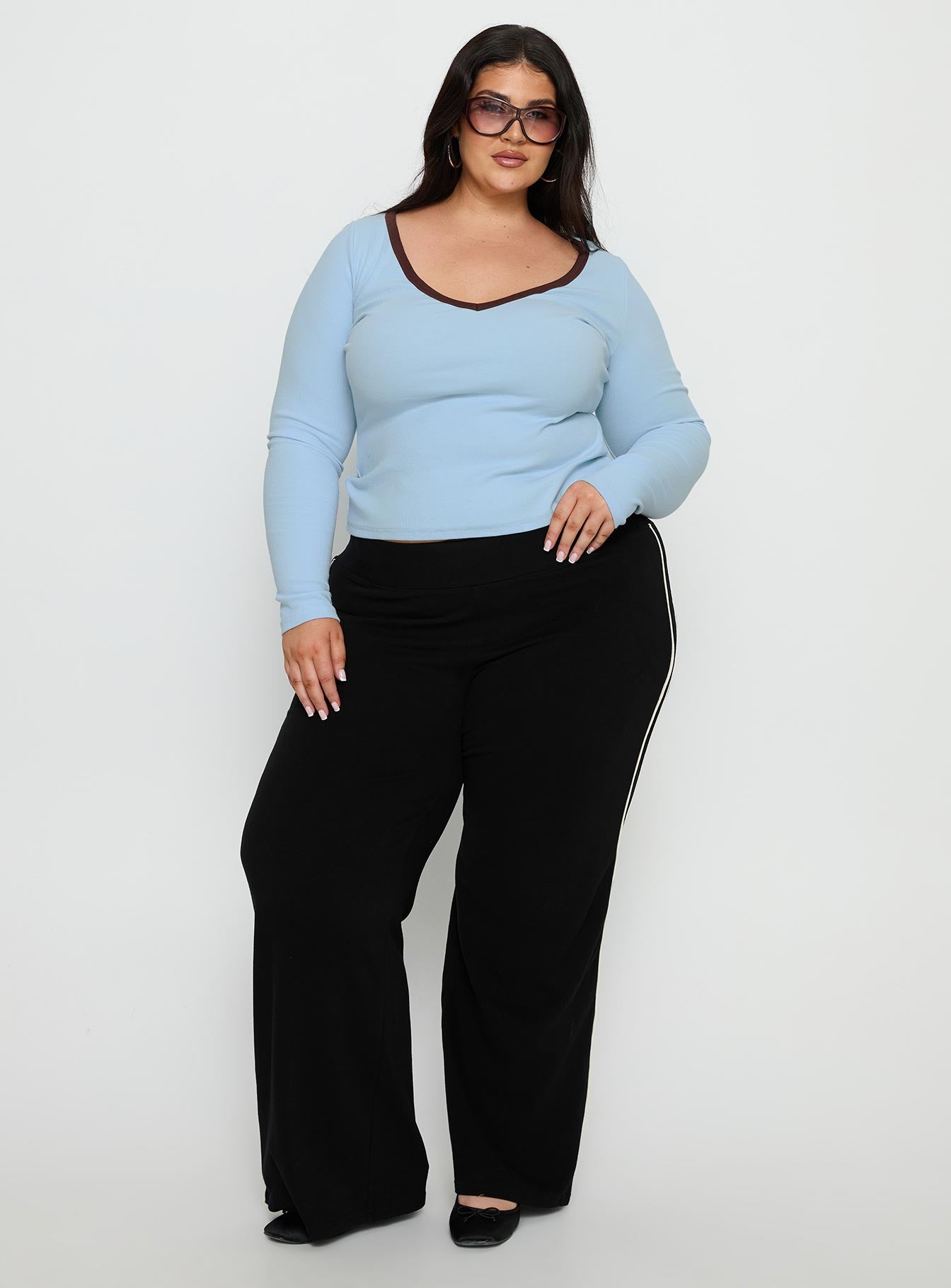 front view of model wearing Princess Polly Ascenda Straight Leg Track Pant Black Curve Mid Rise Pants 