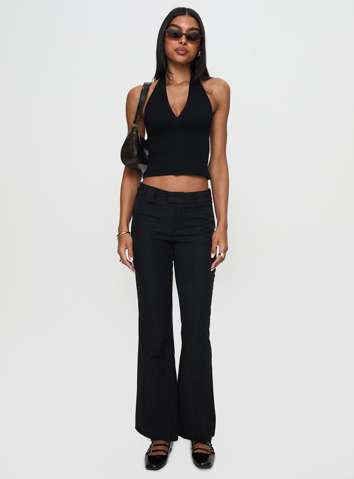 side view of model wearing Princess Polly Jinxed Pant Black Low Rise Pants Pants 