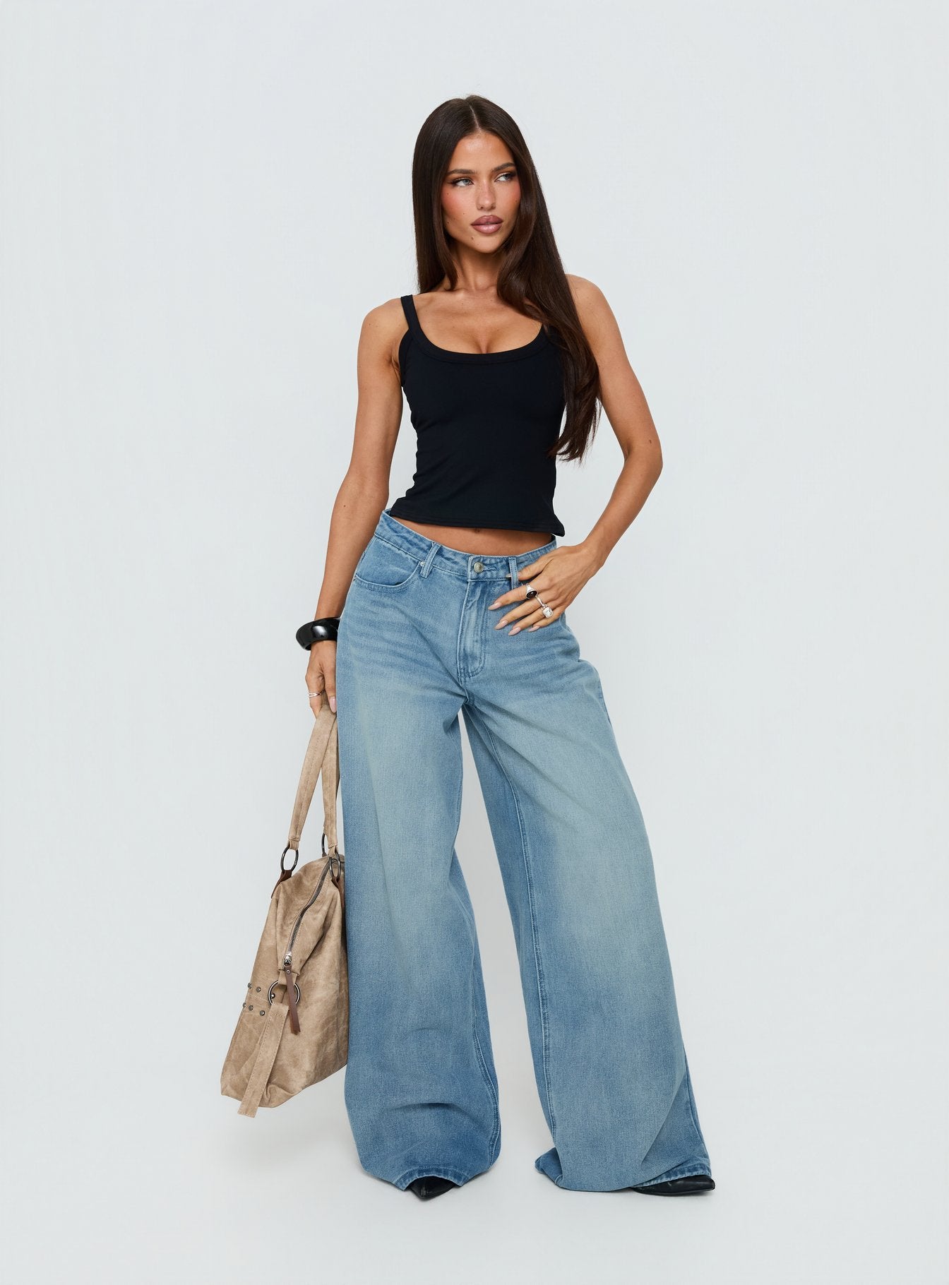 Showcasing Naylor Mid Rise Wide Leg Jeans Light Wash Denim Light Blue Wash Petite in womens-jeans with mid-rise front view of model wearing