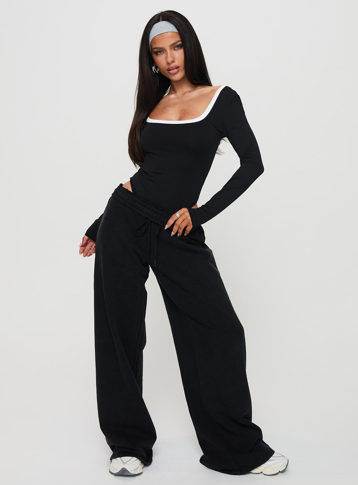 side view of model wearing Princess Polly Ender Contrast Trim Bodysuit Black Long Sleeve Tops 