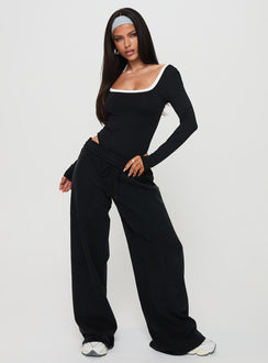 side view of model wearing Princess Polly Ender Contrast Trim Bodysuit Black Long Sleeve Tops 
