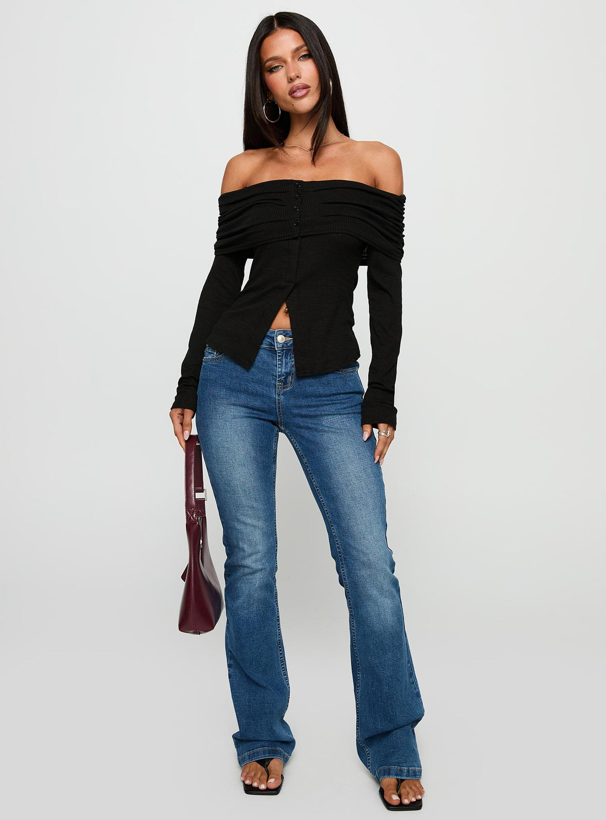 side view of model wearing Princess Polly Victorea Off Shoulder Top Black Full Sleeves straight 
