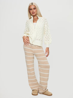 side view of model wearing Princess Polly Sirena Zip Through Knit Sweater Cream 