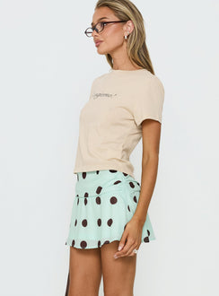   side view of model wearing Princess Polly Elicia Ruched Mini Skirt Mint / Chocolate Polka Dot Mini Skirts 
