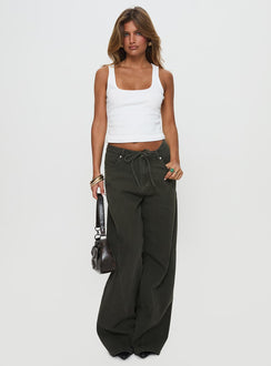 front view of model wearing Princess Polly Bruiser Tie Waist Mid Rise Wide Leg Jeans Green Petite High Rise Jeans 