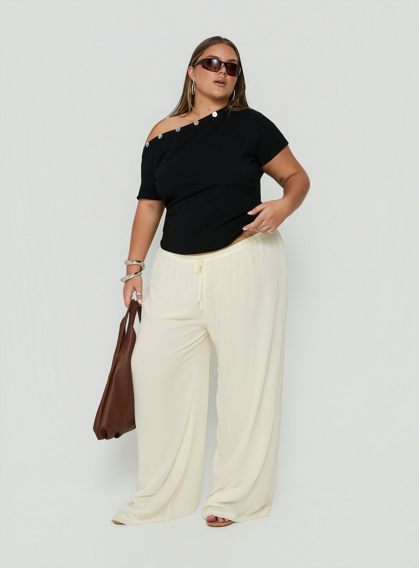 Showcasing Finesse Pants Yellow Curve womens-regular-pants with mid-rise front view of model wearing