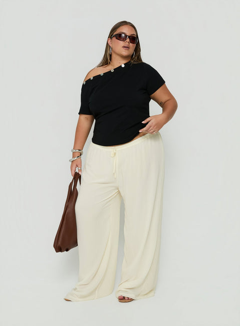 Showcasing Finesse Pants Yellow Curve womens-regular-pants with mid-rise front view of model wearing
