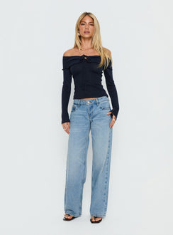 Showcasing Ellanor Low Rise Slouch Denim Jean Washed Mid Blue Wash Petite womens-jeans front view of model wearing Princess Polly