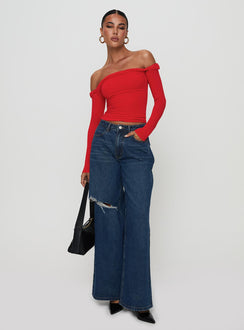 side view of model wearing Princess Polly Dusky Long Sleeve Top Red Full Sleeves straight 