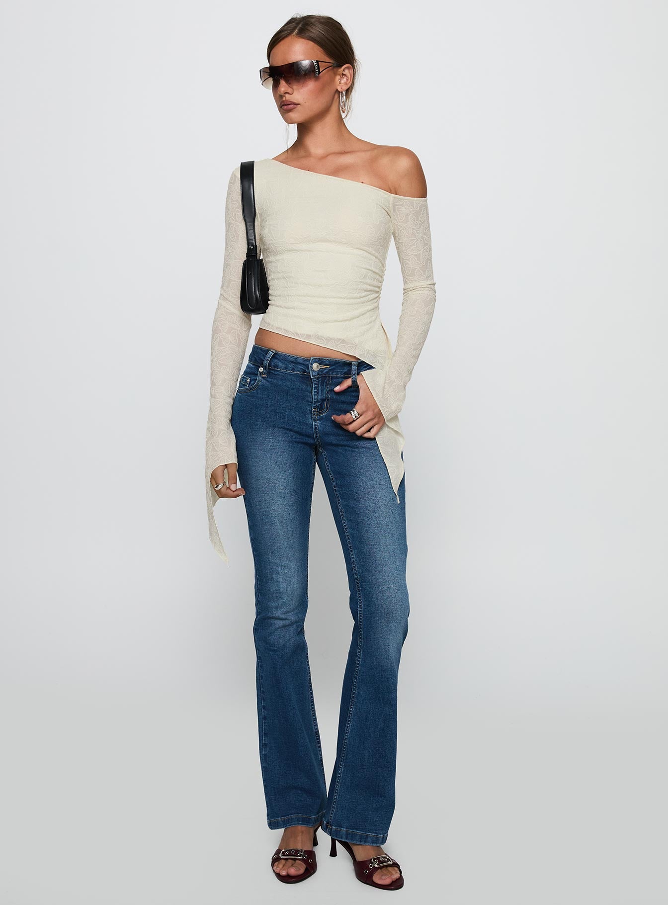 front view of model wearing Princess Polly Face Card Long Sleeve Top Cream Full Sleeves Asymmetric Neckline 