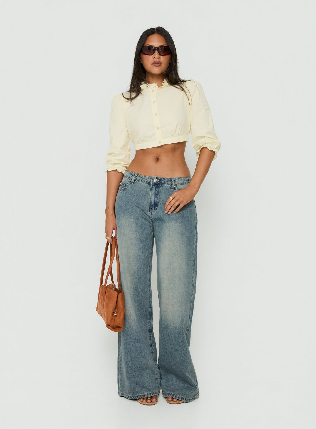 Showcasing Karlos Low Rise Cinched Baggy Jeans Vintage Mid Blue Wash womens-jeans with low-rise detail Princess Polly