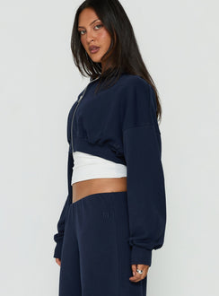 Crafted from fleece, the Lanna Zip Through Cropped Hoodie Navy womens-jumpers with short length side view of model wearing Princess Polly