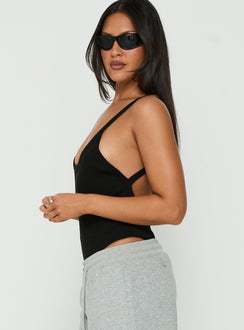 Crafted from the Nerinah Ribbed Bodysuit Black womens-bodysuit with sleeveless side view of model wearing