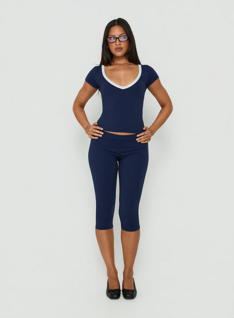 Designed with Rowanna Sporty Capri Pants Navy / Cream womens-regular-pants in high-rise detail view of model wearing