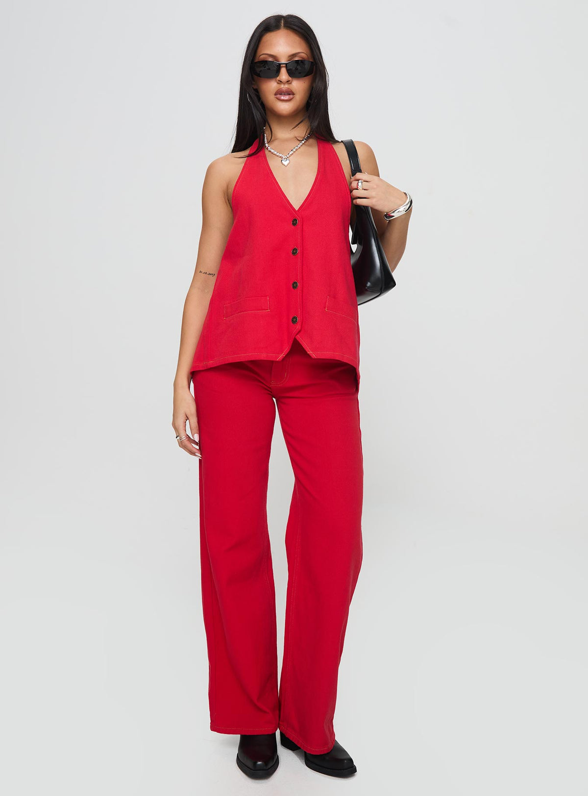 front view of model wearing Princess Polly Top Model Jeans Red Mid Rise 