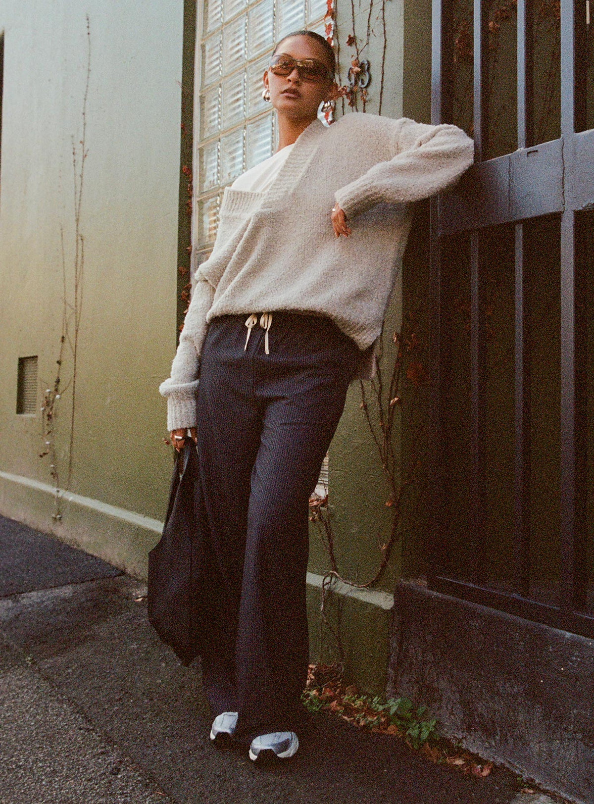 side view of model wearing Princess Polly Seraphic Pants Charcoal Stripe High Waisted Pants 