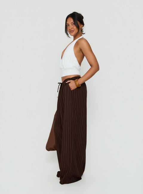 Styled in the Bungala Oversized Relaxed Pants Brown Pinstripe womens-regular-pants with mid-rise side view of model wearing Princess Polly