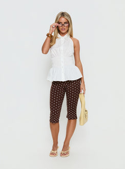 side view of model wearing Princess Polly Samaira Capri Pant Brown Polka Dot Mid Rise Pants Pants 