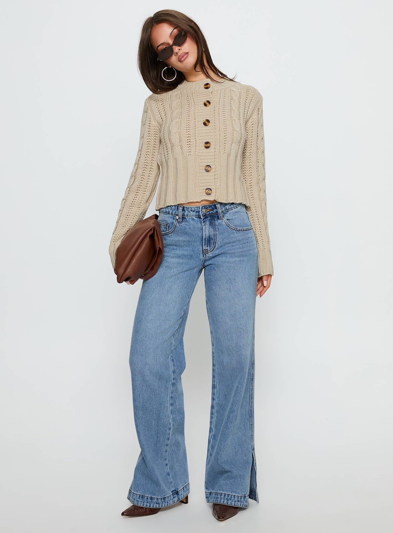 side view of model wearing Princess Polly Donielle Cable Knit Cardigan Beige cropped Jumpers 