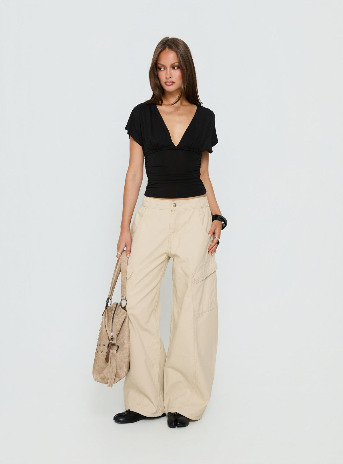 front view of model wearing Princess Polly Selective Memory Low Rise Wide Leg Cargo Pants Cream Low Rise Pants 