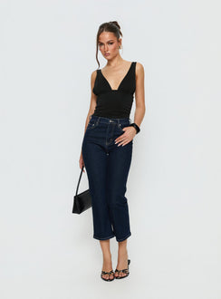 side view of model wearing Princess Polly Cindee High Rise Cropped Jeans Raw Indigo High Rise Jeans 