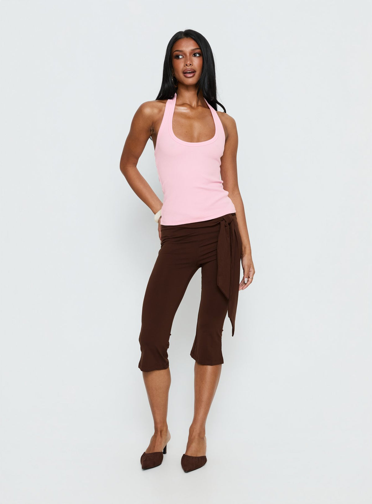 front view of model wearing Princess Polly Lizana Tie Side Capri Pants Brown Mid Rise Pants 