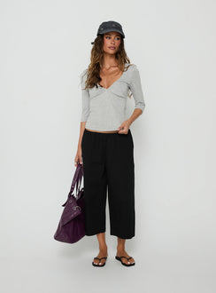 Crafted with the Lunea Concealed Waistband 3/4 Pant Black in womens-regular-pants featuring mid-rise detail view of model wearing Princess Polly