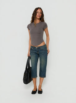 Showcasing the Ceilea Ultra Low Rise Denim Capri Pants Dirty Blue in womens regular pants with low-rise waist front view of model wearing Princess Polly