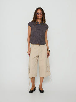 Featuring the Relaxer 3/4 Cargo Pants Beige in womens regular pants with mid-rise front view of model wearing Princess Polly