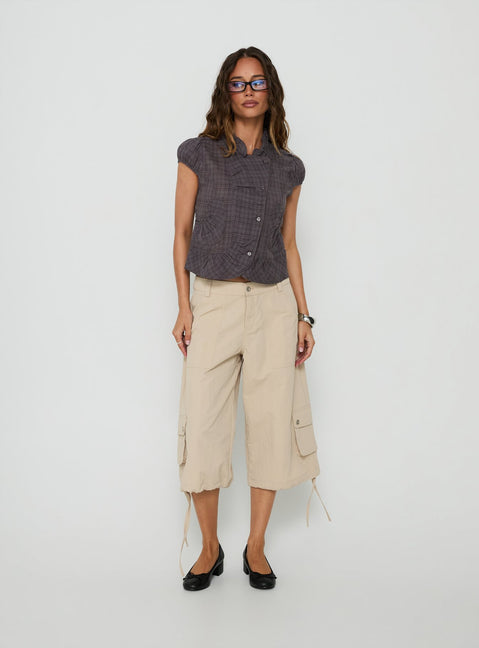 Featuring the Relaxer 3/4 Cargo Pants Beige in womens regular pants with mid-rise front view of model wearing Princess Polly
