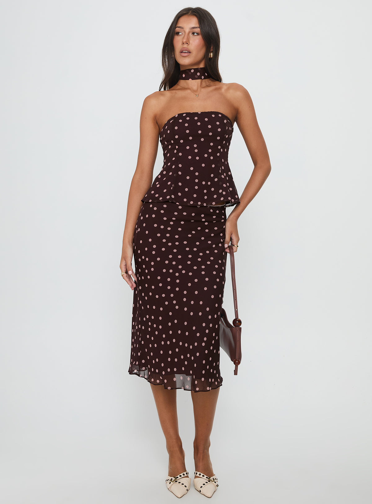   front view of model wearing Princess Polly Sydni Midi Bias Cut Skirt Chocolate / Pink Polka Midi Skirts Skirts 