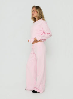 Crafted from Dodie Wide Leg Pants Pink in womens regular pants with mid-rise side view of model wearing