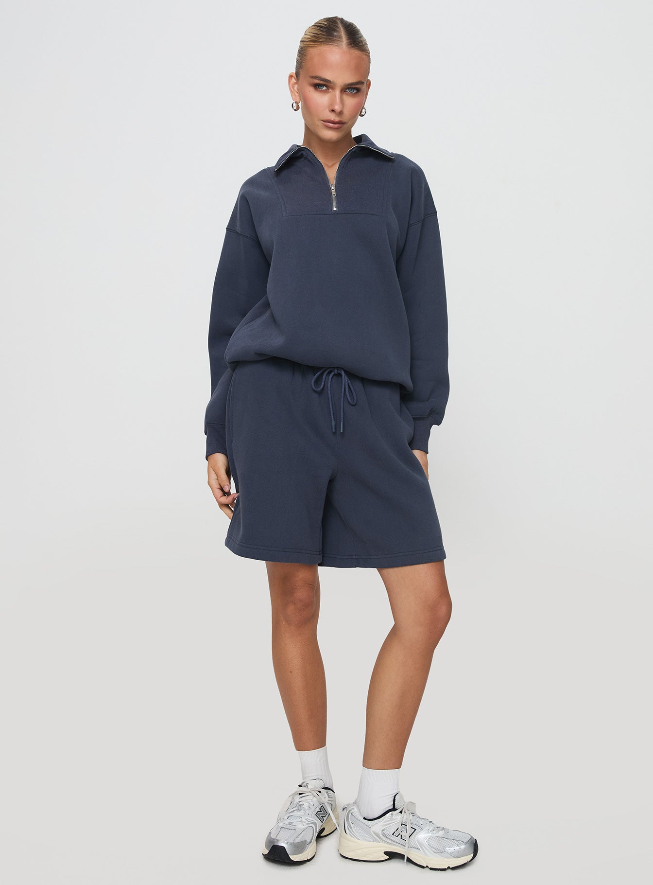 front view of model wearing Princess Polly Dream Fleece Longline Shorts Navy High Waisted Shorts 