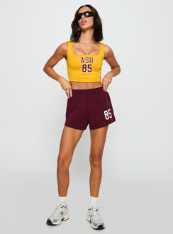 front view of model wearing Princess Polly ASU Jersey Corset Top Gold Sleeveless Square Neck 