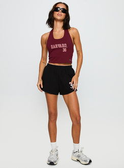 front view of model wearing Princess Polly Harvard Tailgate Halter Top Red Sleeveless Scoop Neck 