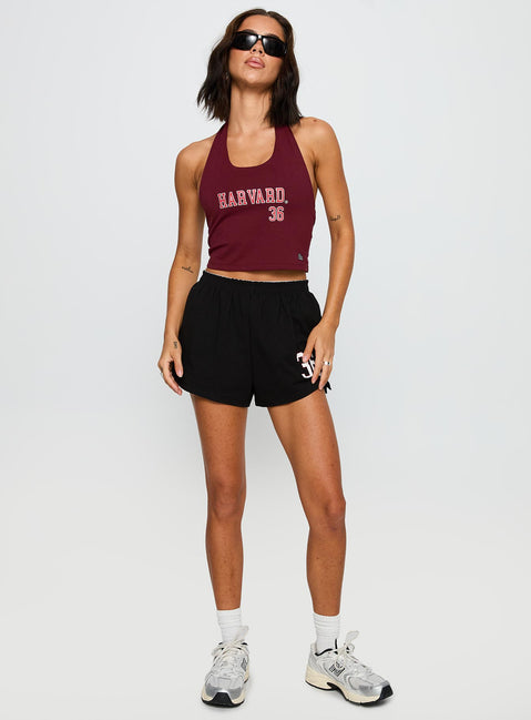 front view of model wearing Princess Polly Harvard Tailgate Halter Top Red Sleeveless Scoop Neck 