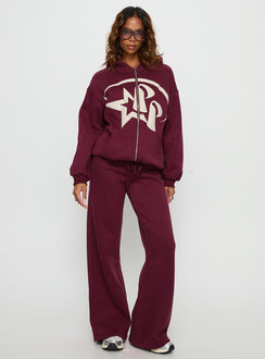 Crafted from the Stargirl Zip Through Jumper in burgundy womens jumpers with long oversized fit, graphic print and hood on-body view of model wearing Princess Polly