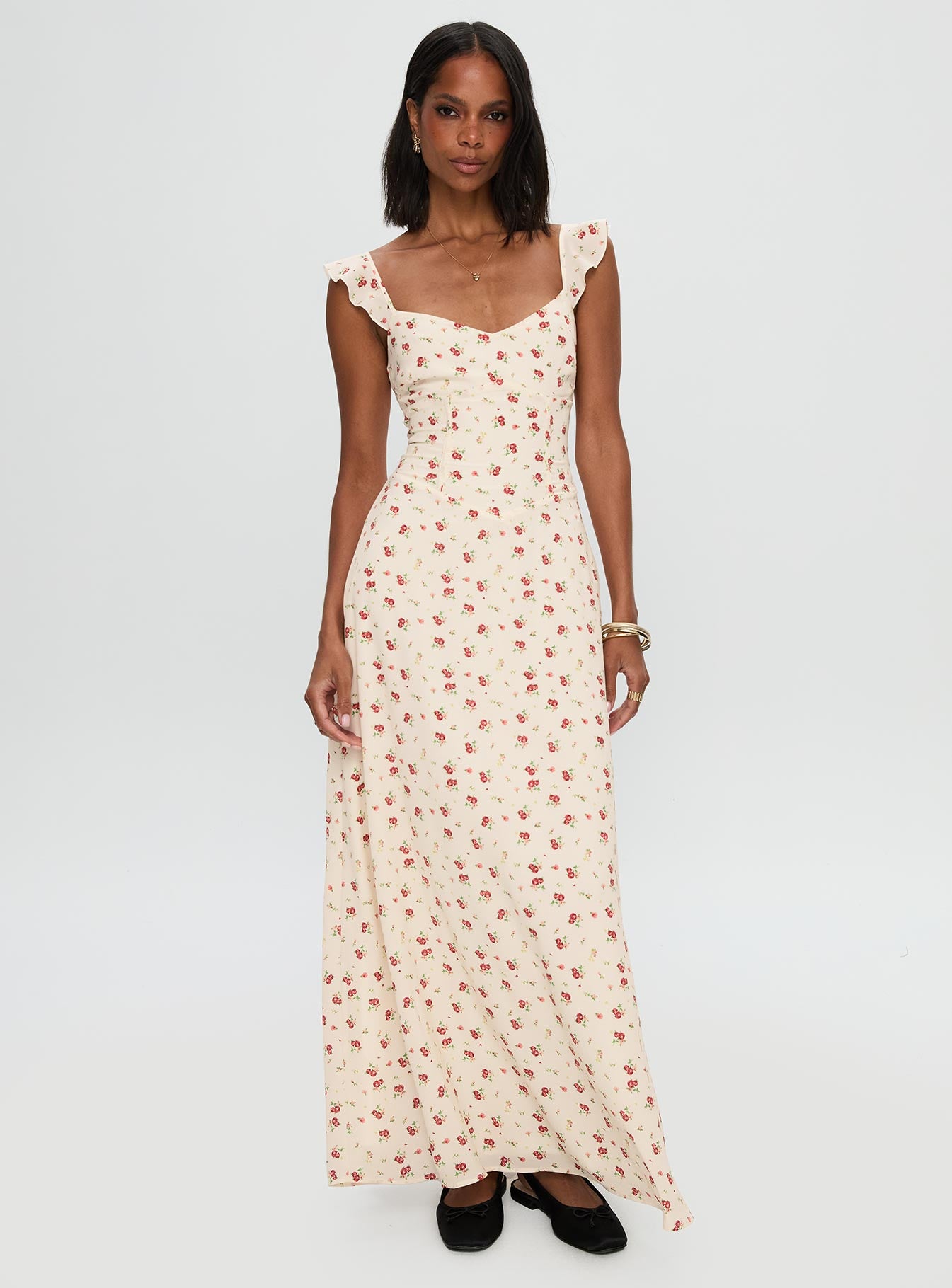 side view of model wearing Princess Polly Maryana Maxi Dress Cream / Multi Sweetheart Neckline 